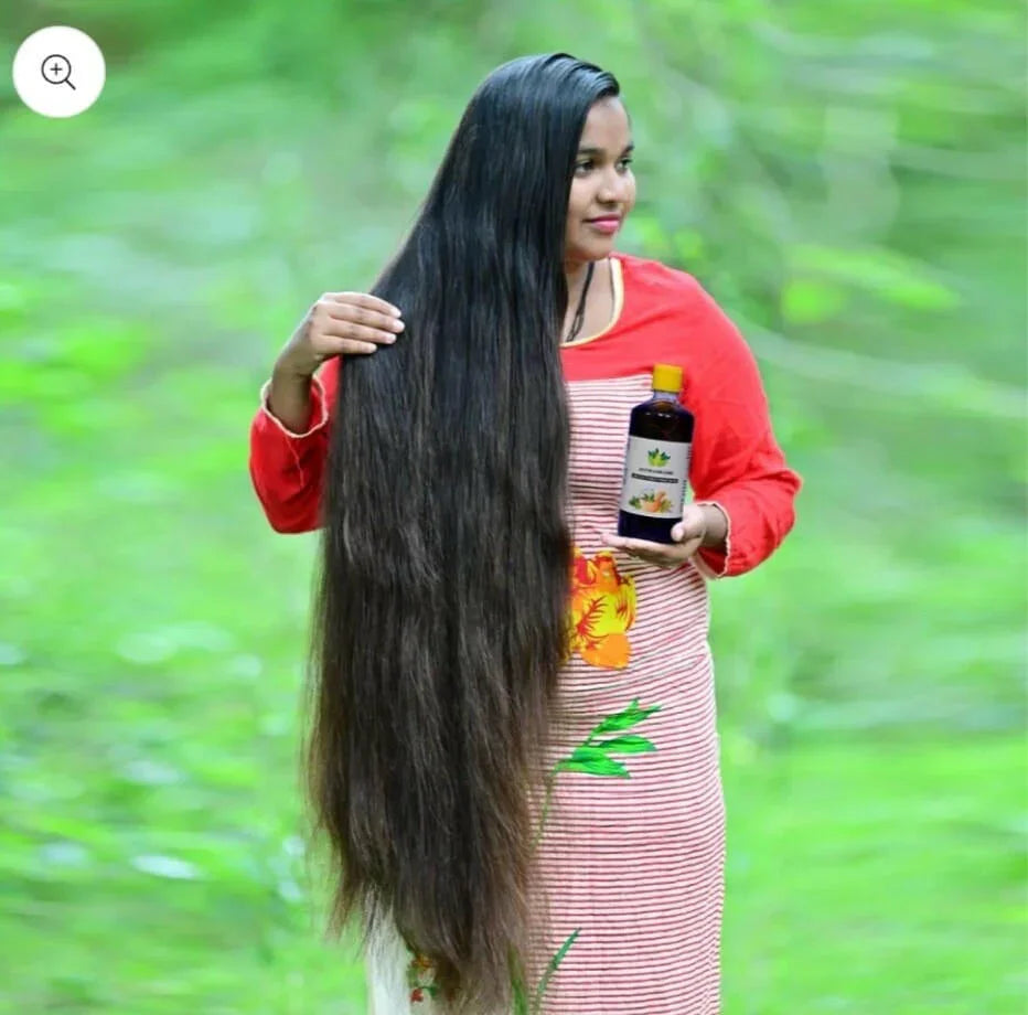 Woman with long hair holding Hakki Pikki Adivasi Hair Oil promoting Hakki Pikki shampoo for hair care