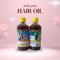 Two bottles of Hakki Pikki hair oil on a pink background with floral elements.